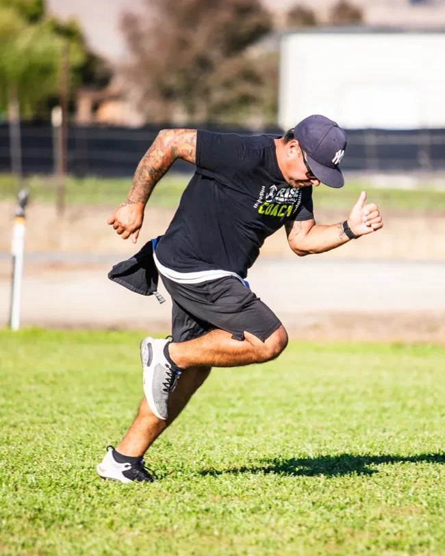 Coach Michael Morales demonstrating a sprint start