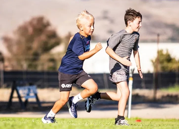 Two young athletes racing at NEXT GEN Speed Lab